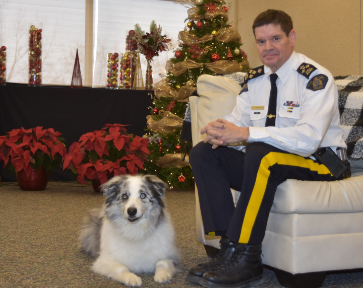 Assistant Commissioner Larry Tremblay with his dog, Denver.