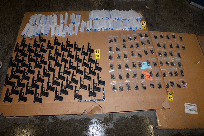 Part of this major seizure. This shows the different components of a handgun assembly. A total of 249 illegal firearms were removed from the market.